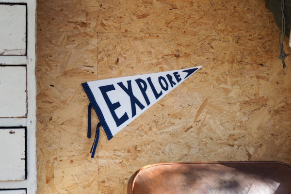An explore flag hanging on a wall