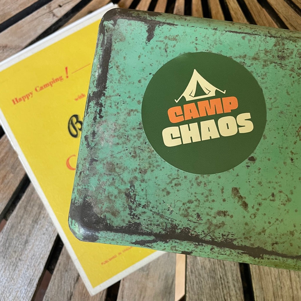 Camp Chaos Vinyl Waterproof Sticker on a tin