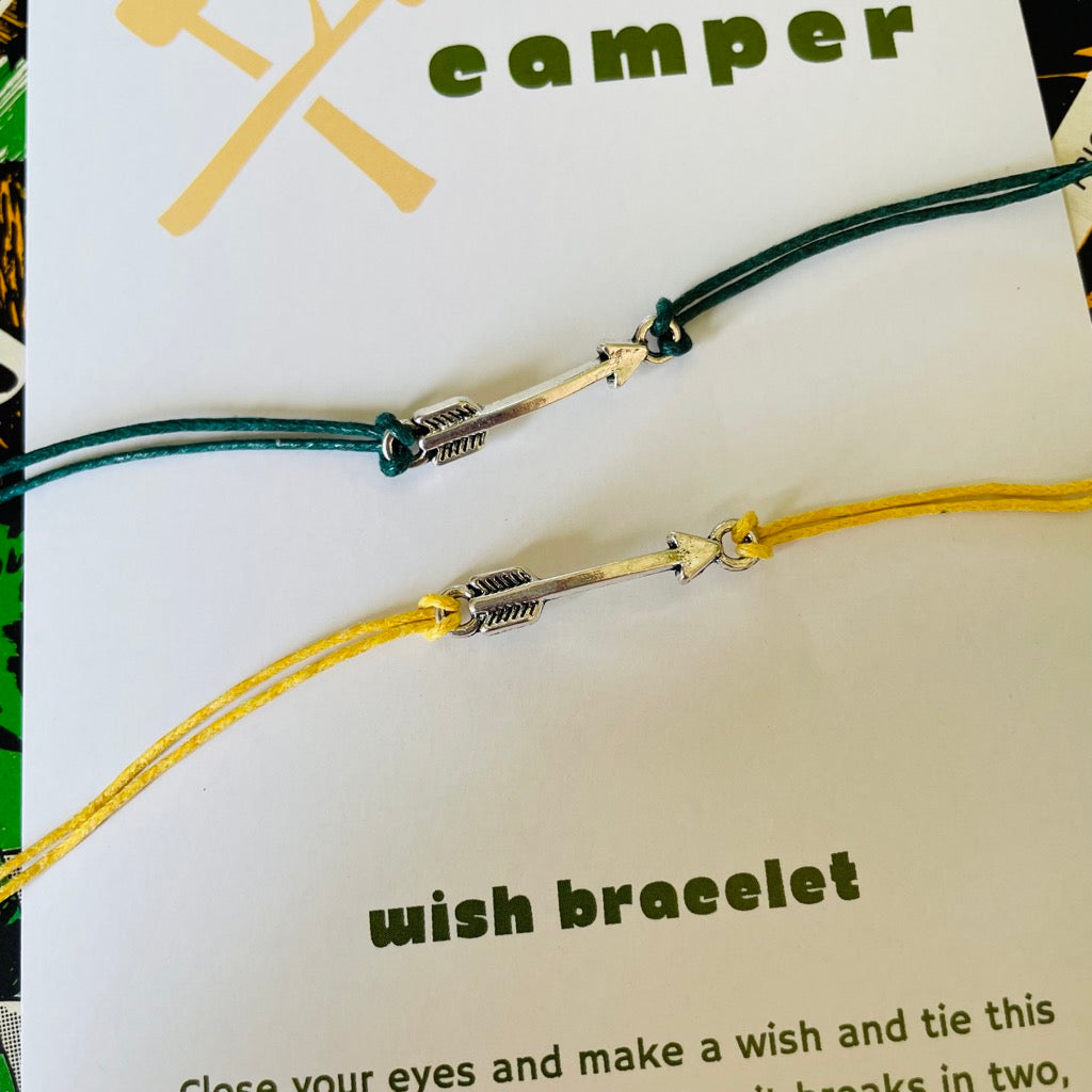 Happy Camper wish Bracelet with an arrow charm on its gift card.