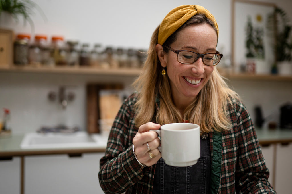 The designer of Pineandbear drinking a cup of tea.