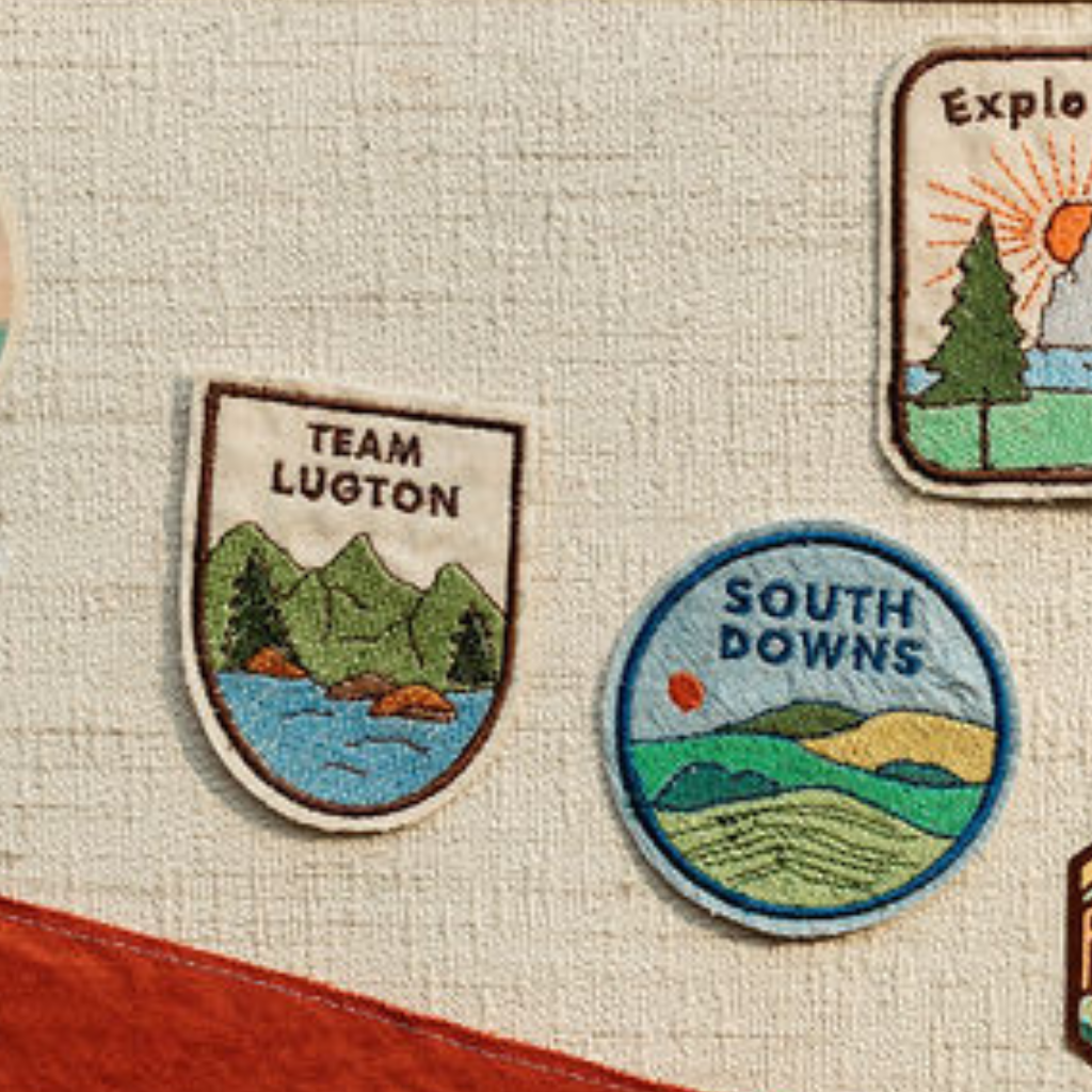 various adventure patches on the outside of a cravan door