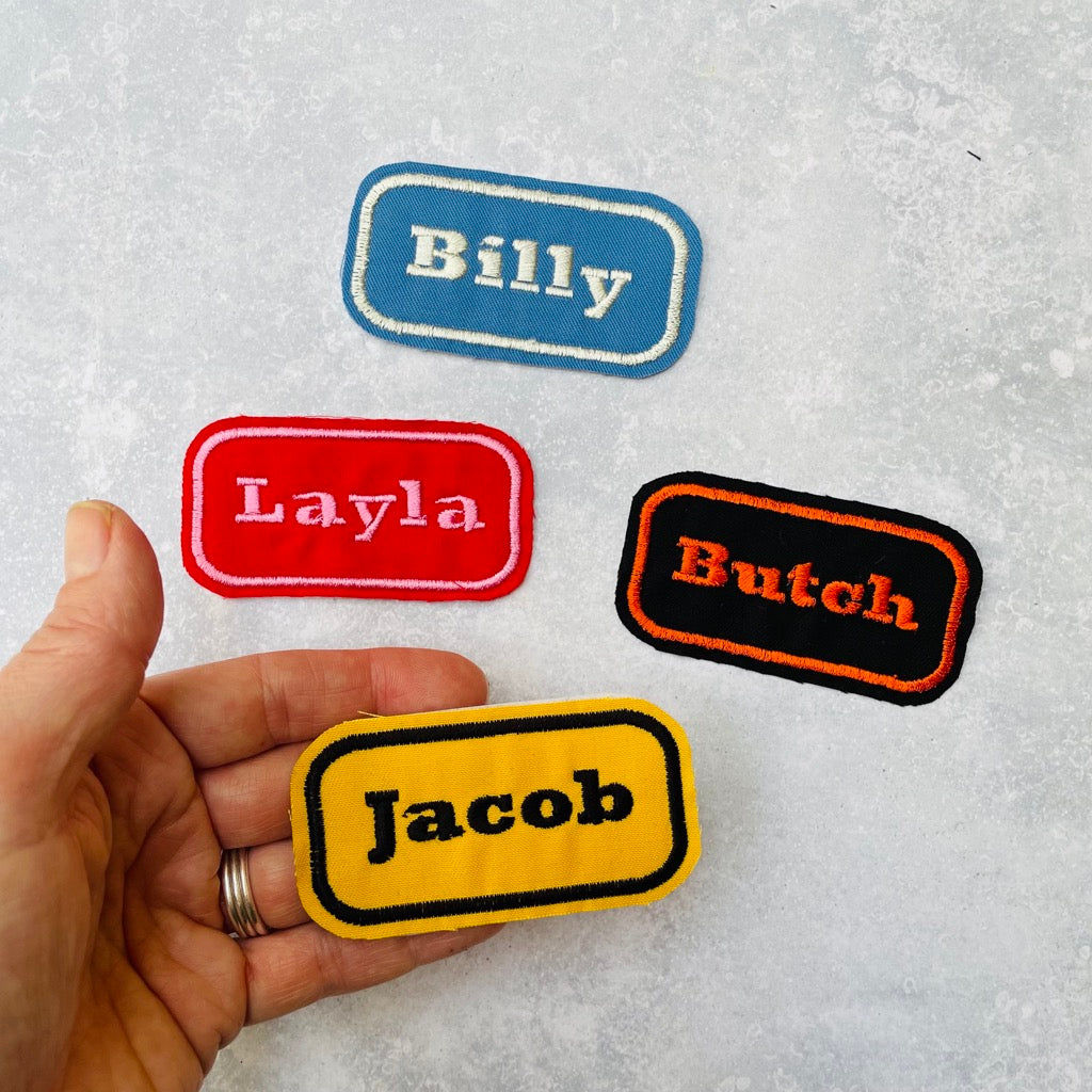 Custom embroidered name patches in various colour options.