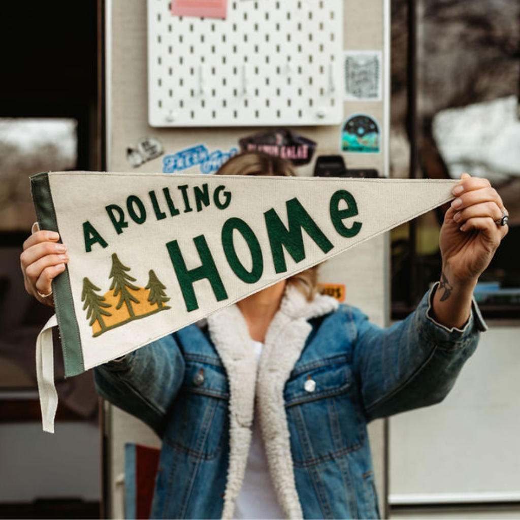 Lady holding a Rolling Home Pennant