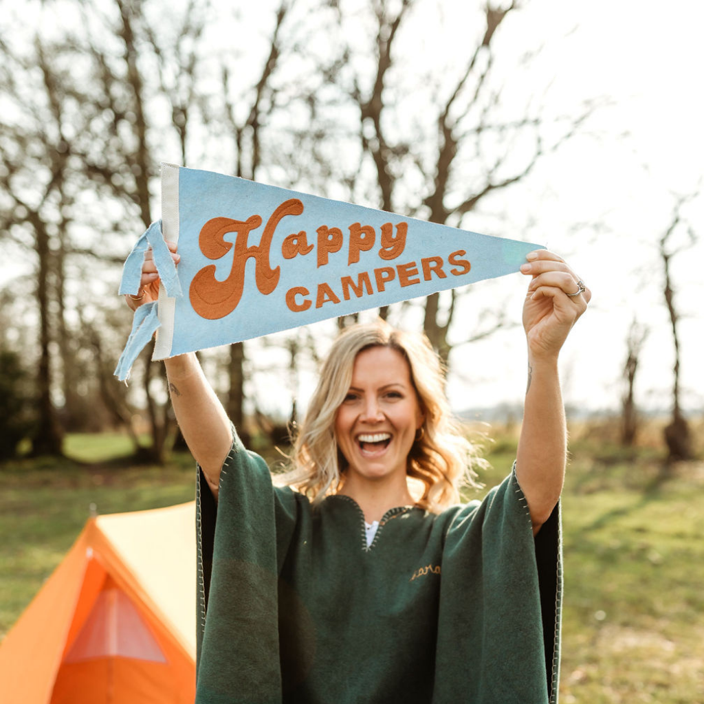 Lady holding Happy Campers Flag