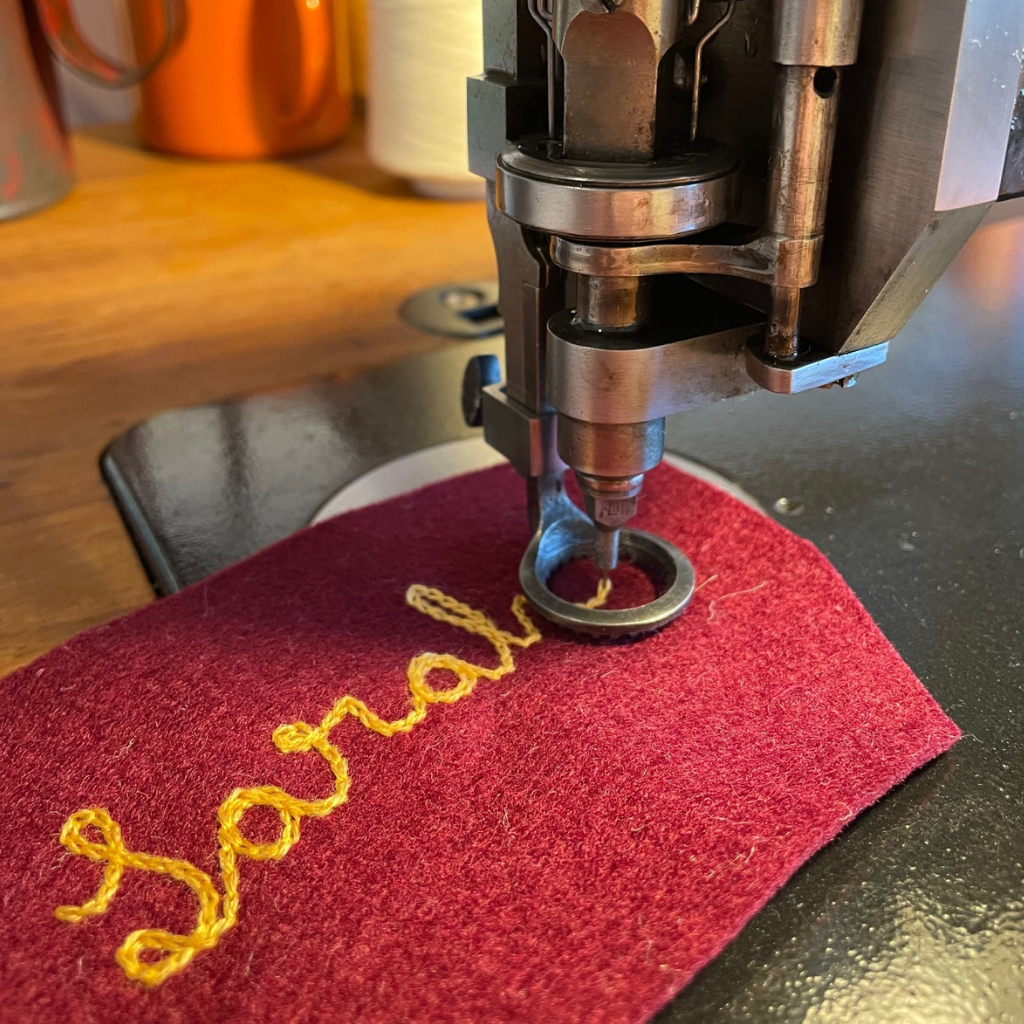 Custom Chain Stitch Machine Embroidering a Name on Felt
