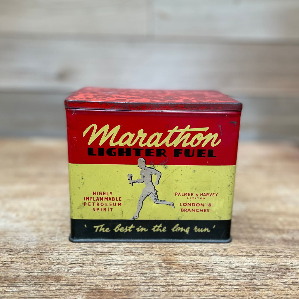 A vintage marathon lighter fuel tin