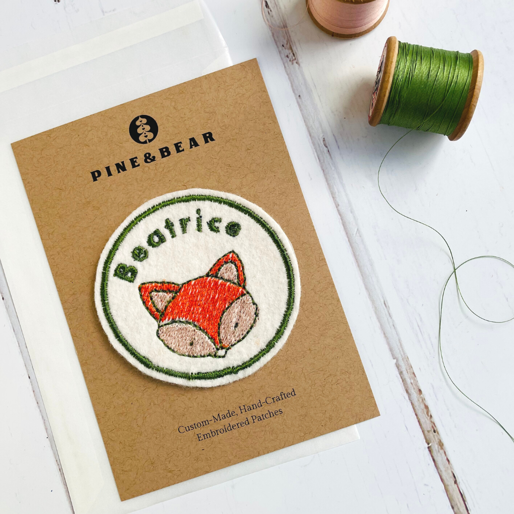 A personalised embroidered name patch with a cute fox design