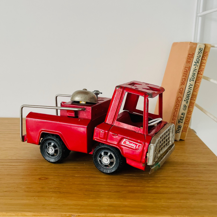 Antique metal shop toy trucks
