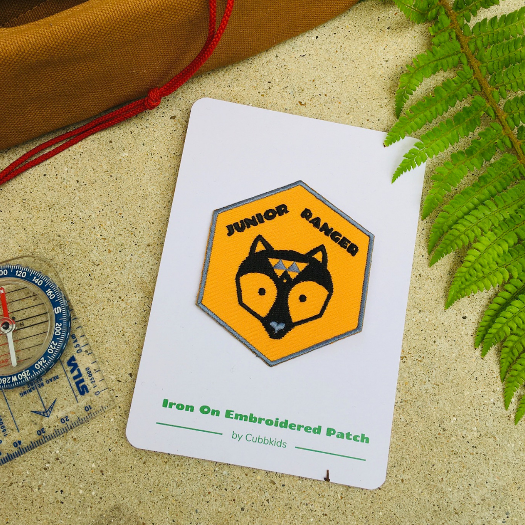 Junior Ranger adventure patch on the presentation card.